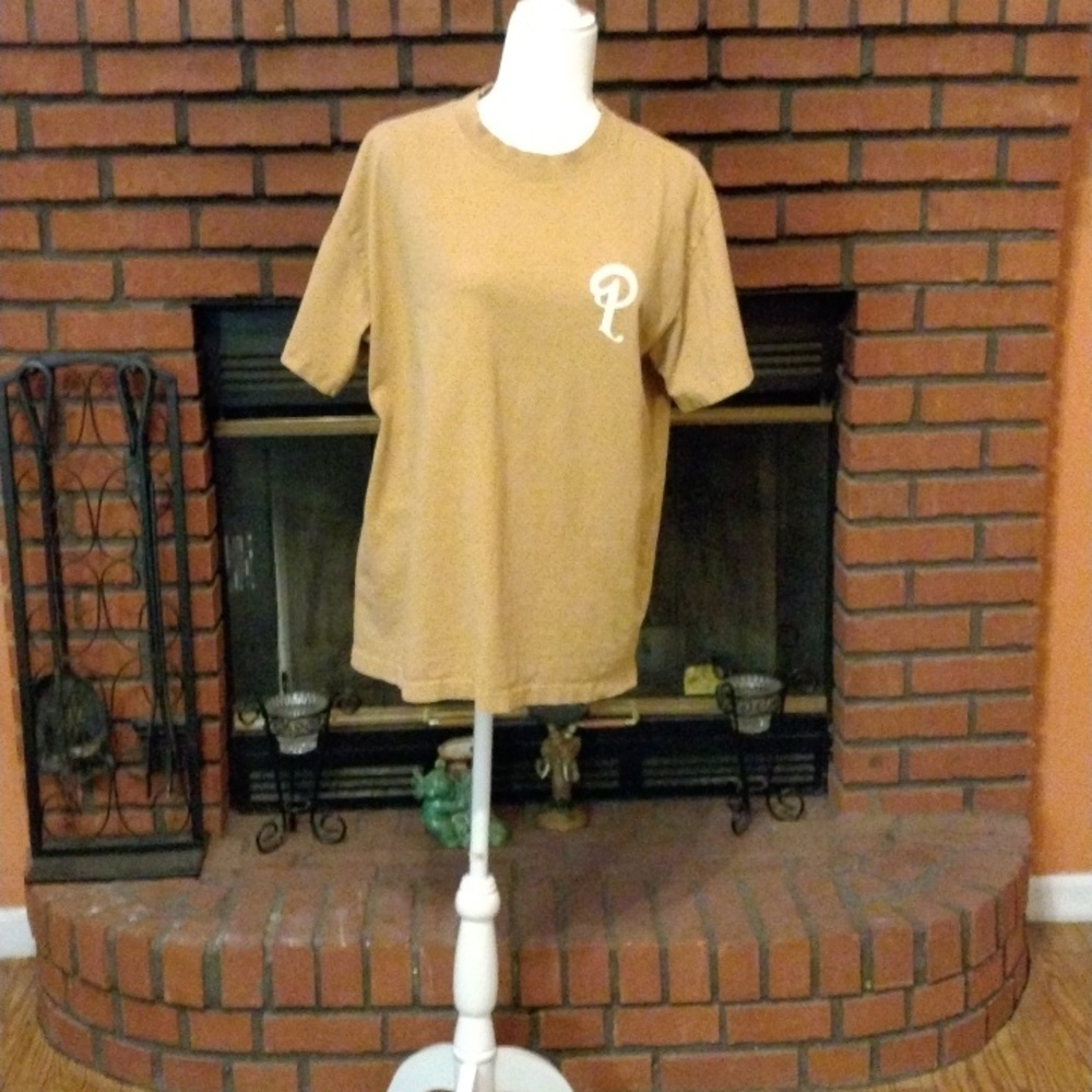 Mustard color shirt with a white P initial